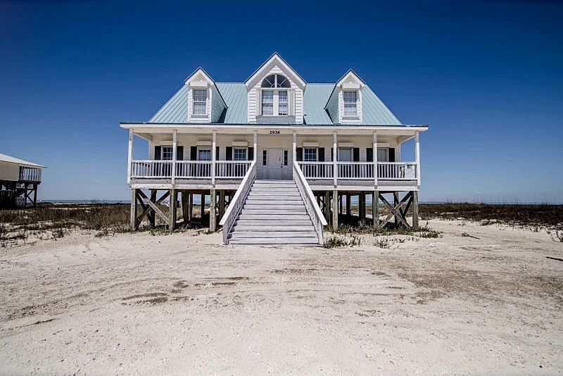 Large Bayfront Home on sandy Bay beach with large screened porch.