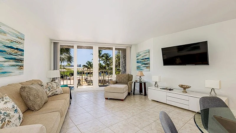Enjoy tropical pool and beach views from the balcony of this lovely...