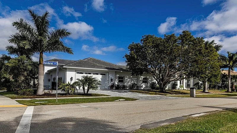 Spacious three-bedroom and two-bath home on the water with heated pool and spa