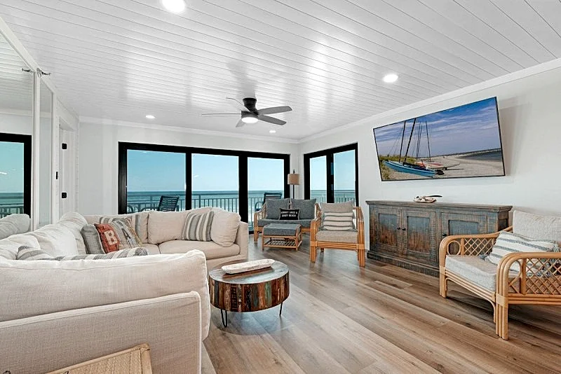 Direct oceanfront condo with a large balcony, heated pool, and beach access