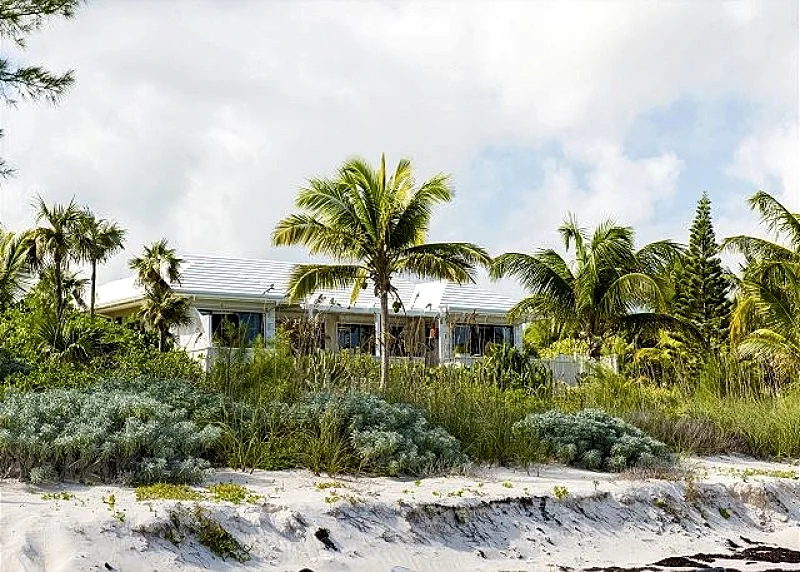 PRIVATE BEACHFRONT ESTATE WITH POOL ON MILES-LONG PINK-SAND BEACH