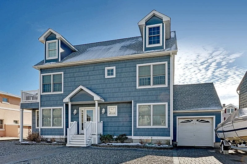 Contemporary ocean block home with three levels of luxurious shore living